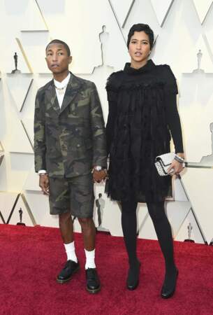 Pharrell Williams en mode écolier camouflé, avec Helen Lasichanh