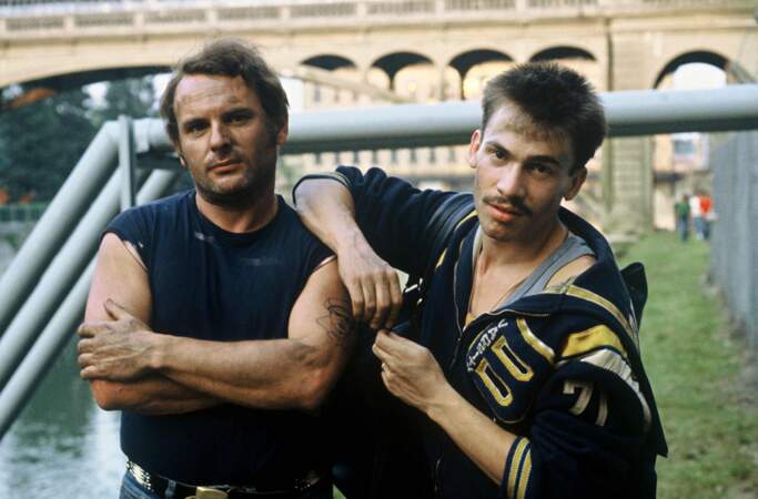 1983. Cheveux en brosse, petite moustache et boucle d'oreille, Florent donne la réplique à Jean-François Stevenin dans le téléfilm "L'ennemi public n°2".