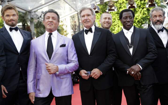 Aux côtés de Sylvester Stallone, Wesley Snipes et Mel Gibson à Cannes en 2014 pour la présentation de Expendables 3.