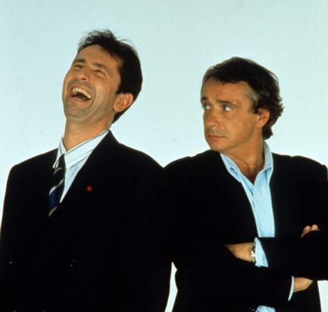 Michel Sardou et Thierry Lhermitte dans le film "Promotion canapé" en 1990.